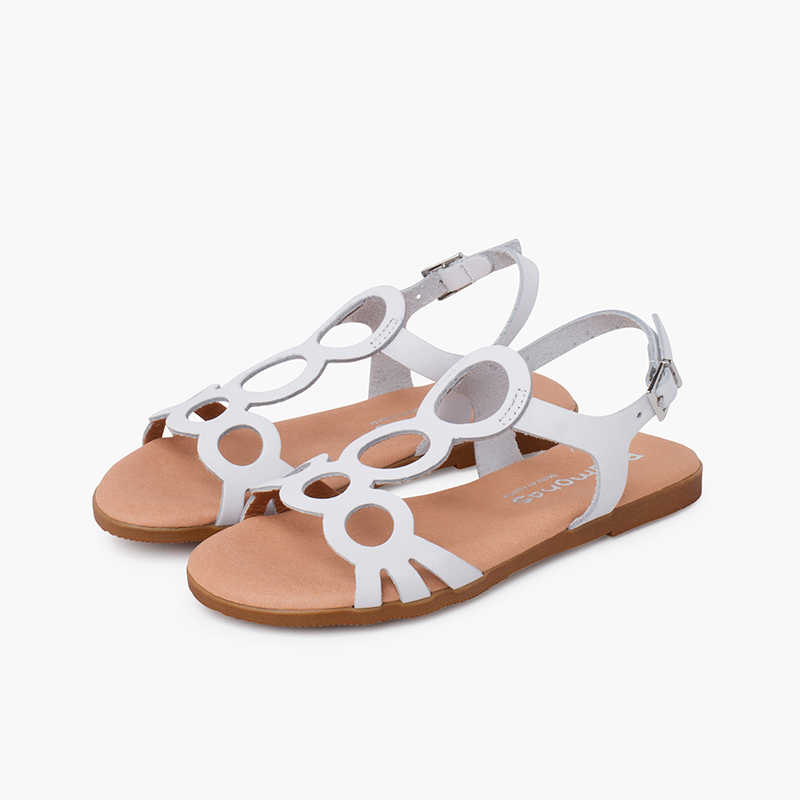 Sandalias niña de piel con círculos y cierre hebilla