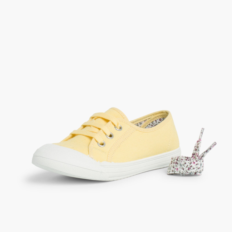 Zapatillas niños de tela con punta de goma y cordones
