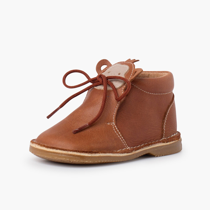 Botita piel cordones cara monito Cuero