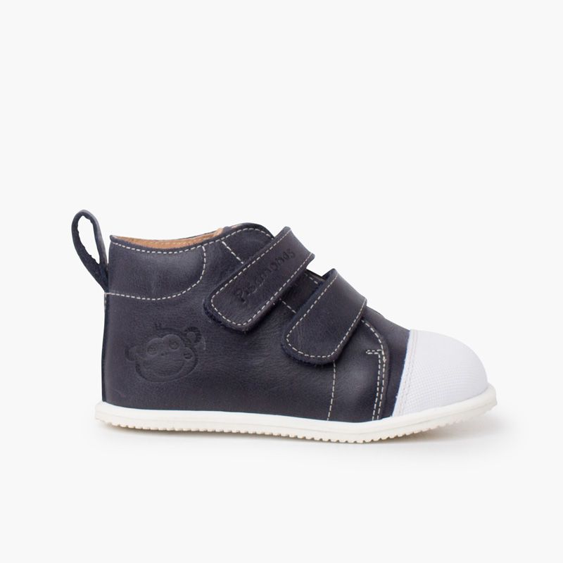Botita piel sport puntera blanca